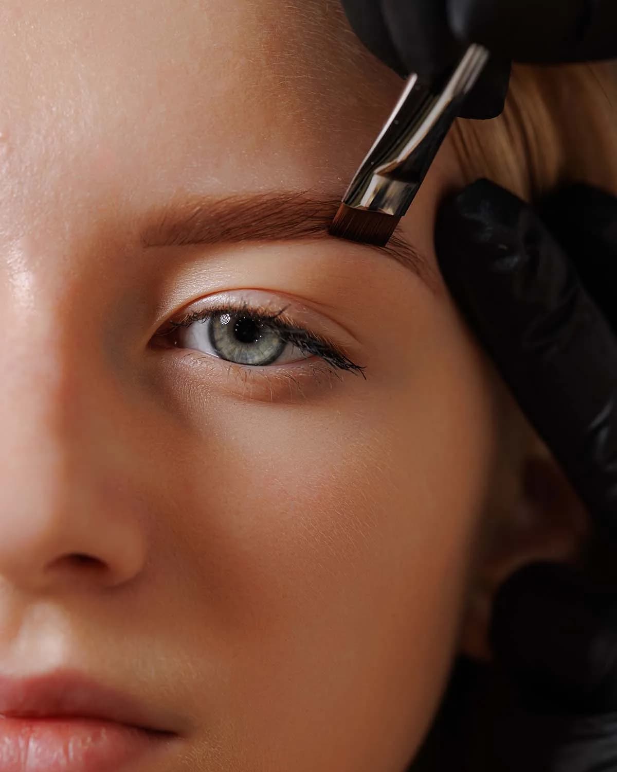 Close-up of an eyebrow being detailed during a brow shaping service